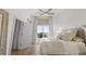 Bright bedroom features hardwood floors, neutral color palette and ceiling fan at 2180 Waterview Dr. # 1044, North Myrtle Beach, SC 29582