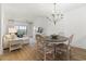 Open dining area with hardwood floors, a chandelier, and a view of the living room at 2180 Waterview Dr. # 1044, North Myrtle Beach, SC 29582