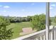Serene view of the golf course from the screened-in porch with lush greenery and a clear sky at 2180 Waterview Dr. # 1044, North Myrtle Beach, SC 29582