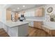 Bright kitchen features custom cabinets, quartz countertops, and hardwood floors at 2180 Waterview Dr. # 1044, North Myrtle Beach, SC 29582