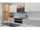 Kitchen features white cabinets, modern appliances, and ample counter space at 2180 Waterview Dr. # 1044, North Myrtle Beach, SC 29582