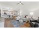 Inviting open-concept living space with hardwood floors and a comfortable neutral-toned sectional sofa at 2180 Waterview Dr. # 1044, North Myrtle Beach, SC 29582