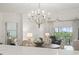 Open-concept living room and dining area with stylish chandelier at 2180 Waterview Dr. # 1044, North Myrtle Beach, SC 29582