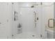 Shower features glass surround, white tile and gold hardware at 2180 Waterview Dr. # 1044, North Myrtle Beach, SC 29582