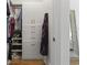 Functional walk-in closet featuring shoe racks, hanging storage, and built-in drawers at 2180 Waterview Dr. # 1044, North Myrtle Beach, SC 29582
