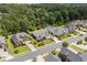 Aerial view of a charming residential area showcasing well-maintained homes, lush landscaping, and a tree-lined street at 235 Welcome Dr., Myrtle Beach, SC 29579