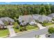 Aerial view of a beautiful home with lush landscaping, palm trees, and a well-manicured lawn in a suburban setting at 235 Welcome Dr., Myrtle Beach, SC 29579