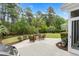 Manicured backyard with patio, seating area, professional landscaping, and privacy fence at 235 Welcome Dr., Myrtle Beach, SC 29579