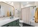 Stylish bathroom with herringbone floors, marble countertop, and green vanity for a modern aesthetic at 235 Welcome Dr., Myrtle Beach, SC 29579