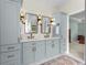 Dual sink bathroom with ample counter space and elegant blue cabinetry, offering modern convenience at 235 Welcome Dr., Myrtle Beach, SC 29579