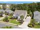 Well-maintained two-story home with manicured lawn, palm trees, and a wide driveway in a residential neighborhood at 235 Welcome Dr., Myrtle Beach, SC 29579
