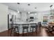 Kitchen features white cabinets, stainless appliances, large island with seating, and hardwood floors at 235 Welcome Dr., Myrtle Beach, SC 29579