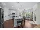 Bright kitchen features white cabinets, stainless appliances, large island, and adjacent breakfast nook at 235 Welcome Dr., Myrtle Beach, SC 29579