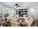 Living room featuring a built-in entertainment center, fireplace, and fan at 235 Welcome Dr., Myrtle Beach, SC 29579