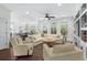 Sun-filled living area with open access to the kitchen and built-ins at 235 Welcome Dr., Myrtle Beach, SC 29579