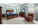 Comfortable main bedroom with tray ceiling, carpet, and plenty of natural light at 235 Welcome Dr., Myrtle Beach, SC 29579