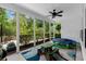 Screened porch with views of backyard, ceiling fan, table, and trampoline at 235 Welcome Dr., Myrtle Beach, SC 29579