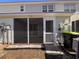 View of back porch with screen door and access to backyard at 238 Seabert Rd. # 238, Myrtle Beach, SC 29579