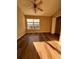 Cozy bedroom with a ceiling fan, offering ample natural light and wood floors creating a welcoming and comfortable space at 238 Seabert Rd. # 238, Myrtle Beach, SC 29579