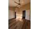 Bright bedroom with wood-look floors, a ceiling fan, closet, and an ensuite bath at 238 Seabert Rd. # 238, Myrtle Beach, SC 29579
