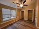 Bedroom featuring wood floors, ceiling fan, and walk in closets and natural light at 238 Seabert Rd. # 238, Myrtle Beach, SC 29579
