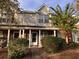 Charming brick townhome with covered front porch and lush landscaping at 238 Seabert Rd. # 238, Myrtle Beach, SC 29579