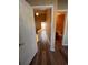 Hallway with wood floors leading to a full bathroom and the bedrooms upstairs at 238 Seabert Rd. # 238, Myrtle Beach, SC 29579