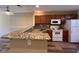Kitchen featuring granite counters, wood cabinets, and modern appliances at 238 Seabert Rd. # 238, Myrtle Beach, SC 29579