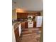 Well-lit kitchen with wood cabinets, granite countertops, and modern appliances at 238 Seabert Rd. # 238, Myrtle Beach, SC 29579