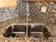 Close-up of a stainless steel kitchen sink with a modern faucet and mosaic tile backsplash at 238 Seabert Rd. # 238, Myrtle Beach, SC 29579