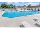 Community pool with plenty of lounge seating and palm trees at 238 Seabert Rd. # 238, Myrtle Beach, SC 29579
