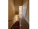 Carpeted staircase leads to the upper level, featuring wood floors in the hallway at 238 Seabert Rd. # 238, Myrtle Beach, SC 29579