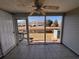 Relaxing sun room with tile flooring and a beautiful view of the pond at 238 Seabert Rd. # 238, Myrtle Beach, SC 29579