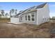 A view of new home backyard with concrete patio and white fence at 2615 Elowen Ln. # 109A, Longs, SC 29568