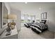 Bright bedroom with two twin beds, contemporary decor, and scenic outdoor views at 2615 Elowen Ln. # 109A, Longs, SC 29568