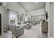 Spacious living room with high ceilings, large windows, and stylish contemporary furnishings at 2615 Elowen Ln. # 109A, Longs, SC 29568