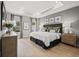 Serene main bedroom featuring a plush bed, stylish decor, and plenty of natural light at 2615 Elowen Ln. # 109A, Longs, SC 29568
