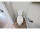 Contemporary powder room showcasing a modern toilet, hardware, and light wood flooring at 2615 Elowen Ln. # 109A, Longs, SC 29568
