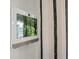 A smart panel mounted on the wall next to a window with striped curtain at 2615 Elowen Ln. # 109A, Longs, SC 29568