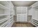 Organized walk-in closet with custom shelving and drawers for ample storage at 2615 Elowen Ln. # 109A, Longs, SC 29568