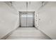A clean and spacious garage interior showing ample room for parking and storage at 2616 Elowen Ln. # 167B, Longs, SC 29568