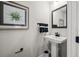 Stylish powder room with modern fixtures, including a pedestal sink, and attractive decor at 2616 Elowen Ln. # 167B, Longs, SC 29568