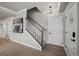 Hallway with a staircase, wood flooring, and a modern light fixture at 2616 Elowen Ln. # 167B, Longs, SC 29568