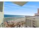 Beautiful beachfront view from condo balcony with seating area for serene relaxation at 2701 N Ocean Blvd. # 1260, Myrtle Beach, SC 29577