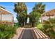 Path to the beach with lush greenery and decorative structures on either side at 2701 N Ocean Blvd. # 1260, Myrtle Beach, SC 29577