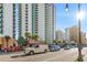 Low angle street view of tall buildings showing parking, street traffic and palm trees at 2701 N Ocean Blvd. # 1260, Myrtle Beach, SC 29577