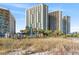 High-rise condos, beautiful sand dunes, and greenery enhance the scenic location near a beach at 2701 N Ocean Blvd. # 1260, Myrtle Beach, SC 29577