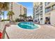 Outdoor pool area with lounge chairs and palm trees surrounding the building at 2701 N Ocean Blvd. # 1260, Myrtle Beach, SC 29577