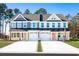 Charming townhome with colorful front doors, white garage doors, and manicured lawn at 2703 Elowen Ln. # 111B, Longs, SC 29568
