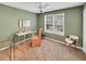 Bedroom featuring a ceiling fan, a large window, and neutral carpeting at 28 Torrens Pl., Pawleys Island, SC 29585